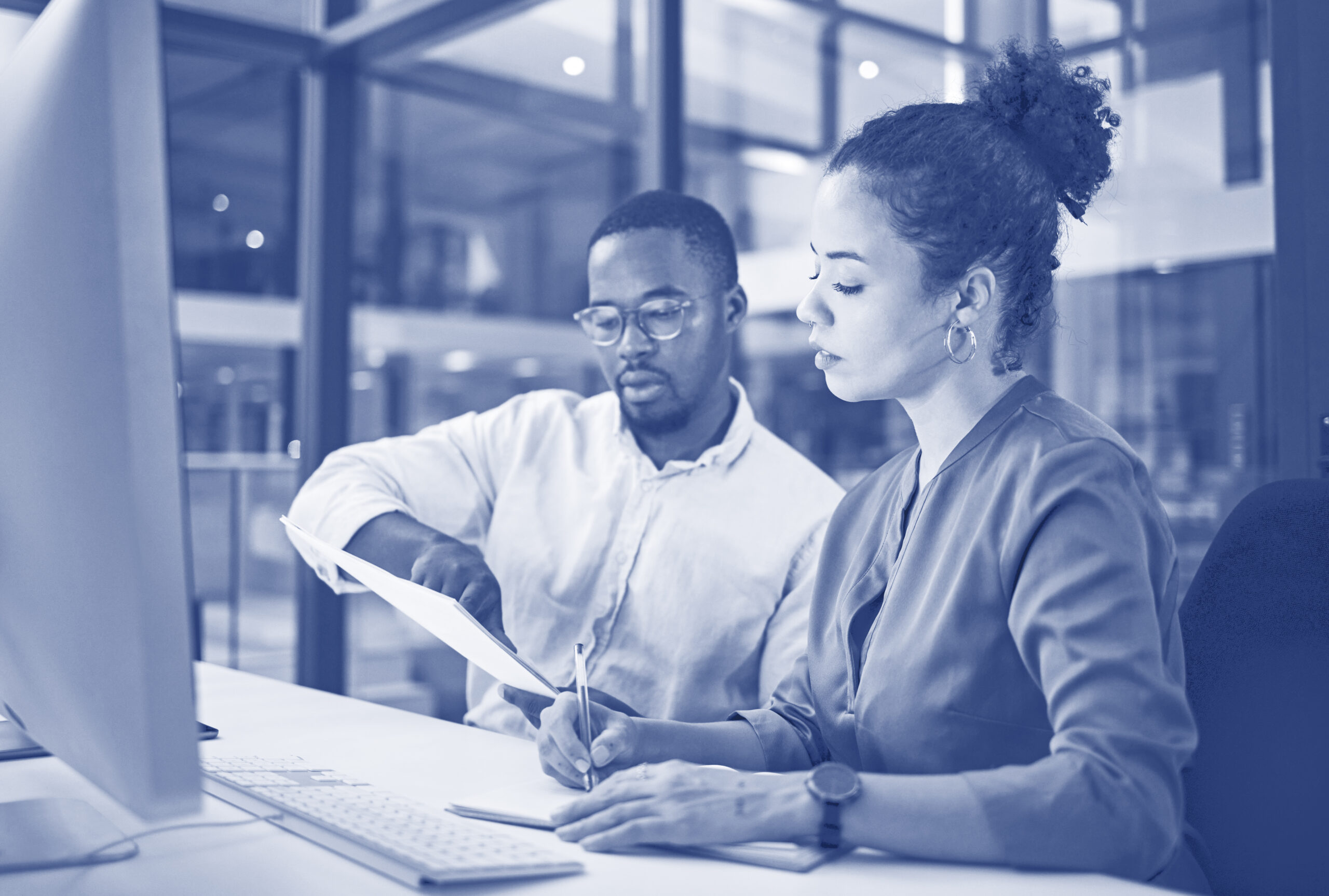 Teamwork in New York office at night, business document reading together and professional accounting report. Black man with financial audit, showing latino woman figures and employee collaboration
